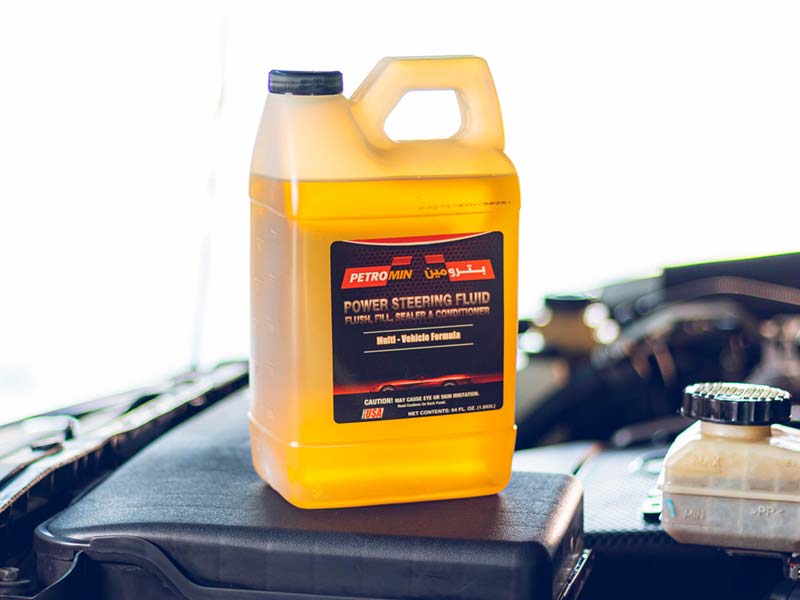 power steering fluid bottle on the car bonnet